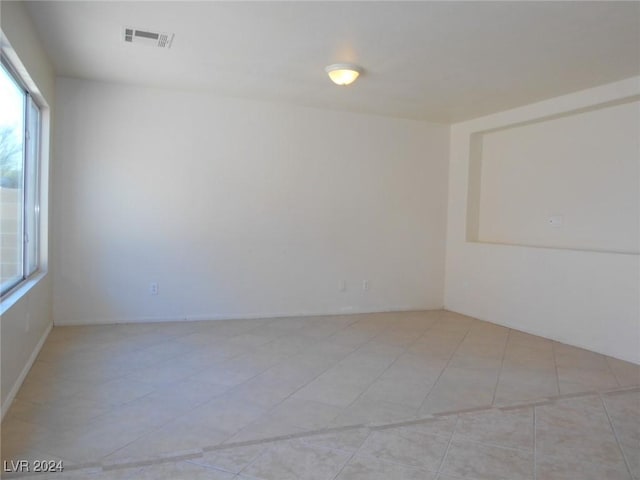 spare room with light tile patterned floors