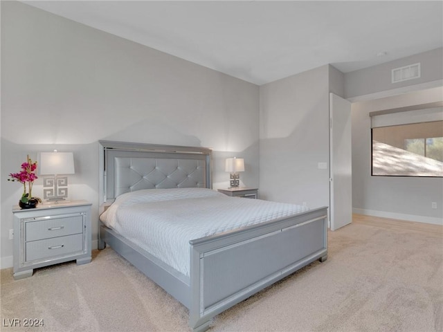 bedroom with light colored carpet