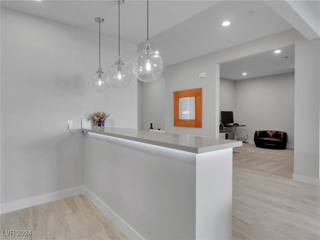 kitchen featuring pendant lighting and kitchen peninsula