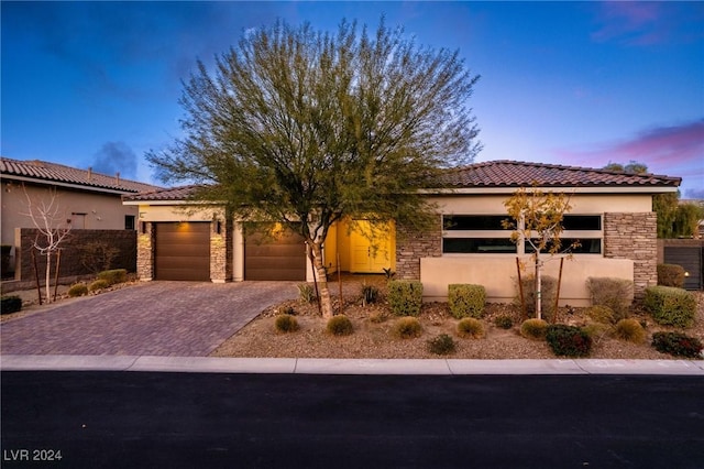 mediterranean / spanish house with a garage