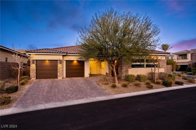 view of front of home with a garage