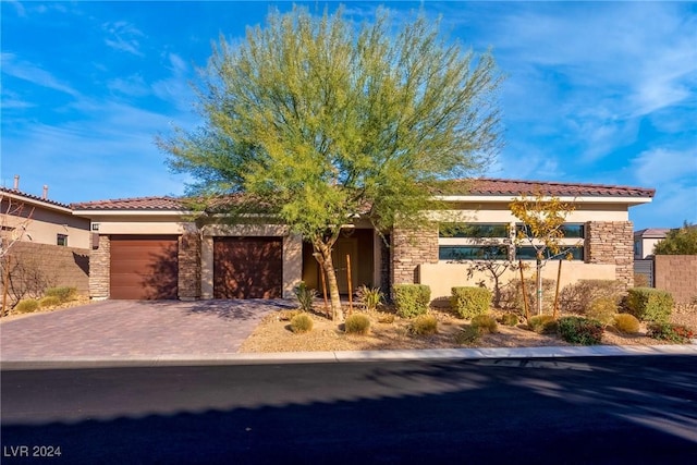 view of front of home with a garage