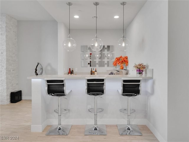 bar featuring decorative light fixtures