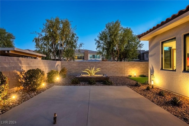 view of patio terrace at dusk