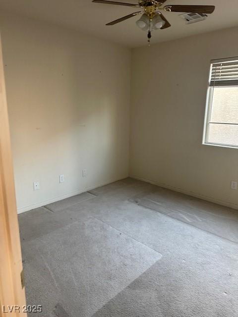 empty room with carpet and ceiling fan