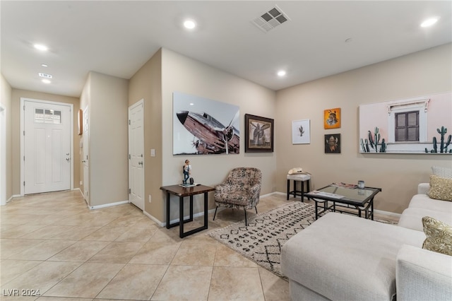 living area featuring recessed lighting, visible vents, baseboards, and light tile patterned flooring