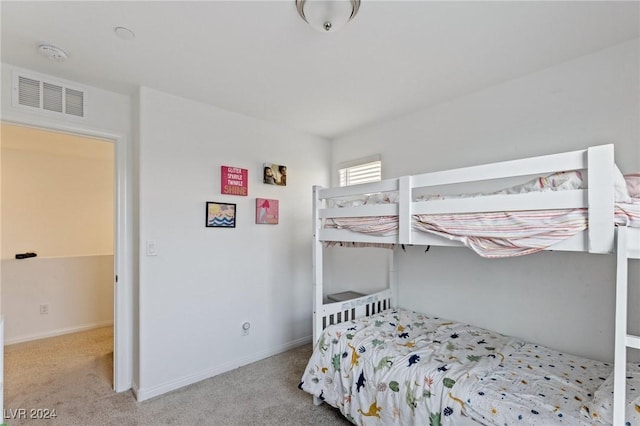 bedroom with light colored carpet