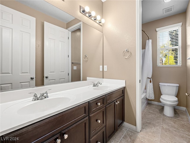 full bathroom with shower / tub combo, vanity, toilet, and tile patterned floors