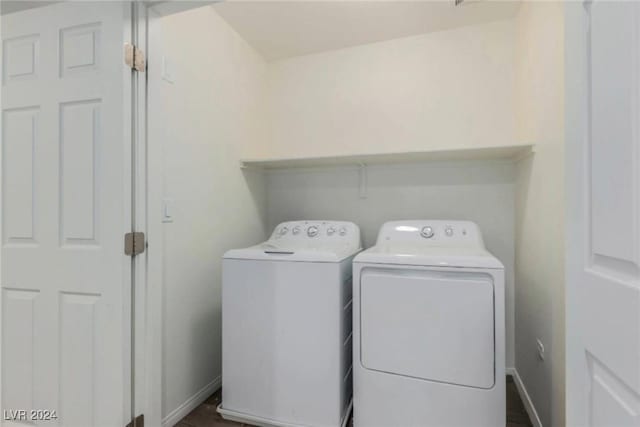 clothes washing area with laundry area, baseboards, and separate washer and dryer