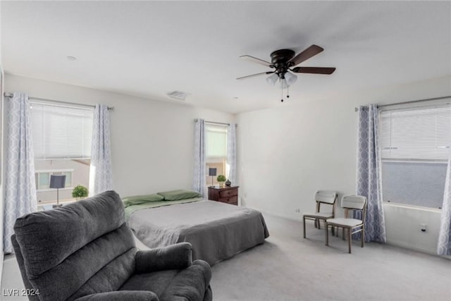 carpeted bedroom with a ceiling fan