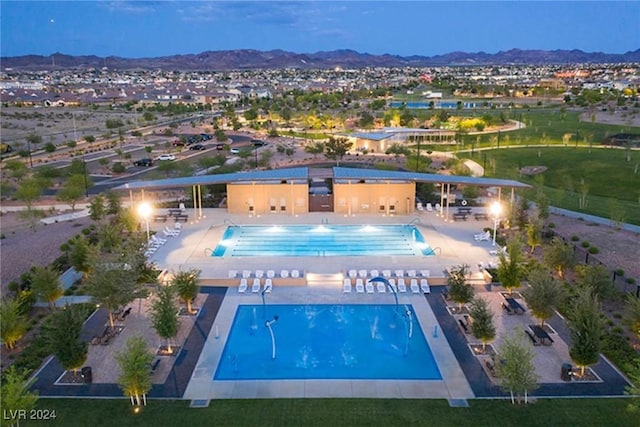 pool with a mountain view and a patio