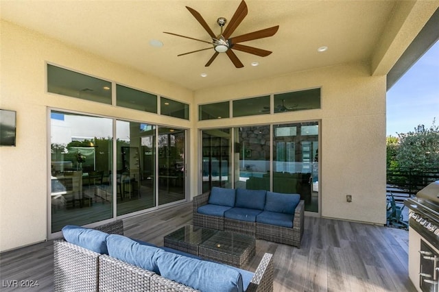 view of patio featuring an outdoor living space, ceiling fan, and a deck