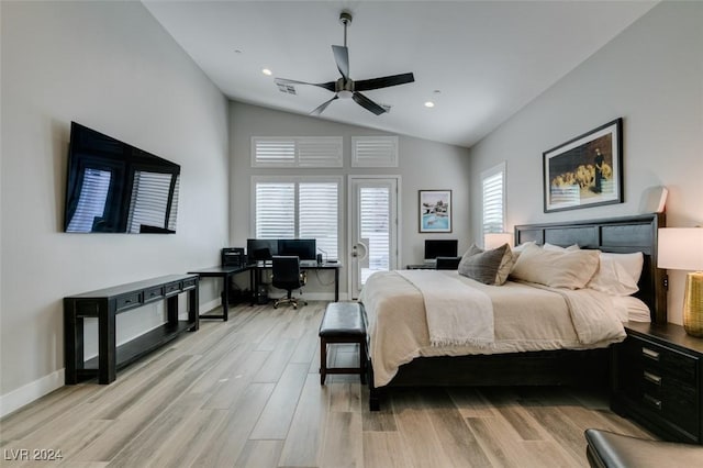 bedroom with ceiling fan, vaulted ceiling, and light wood-type flooring