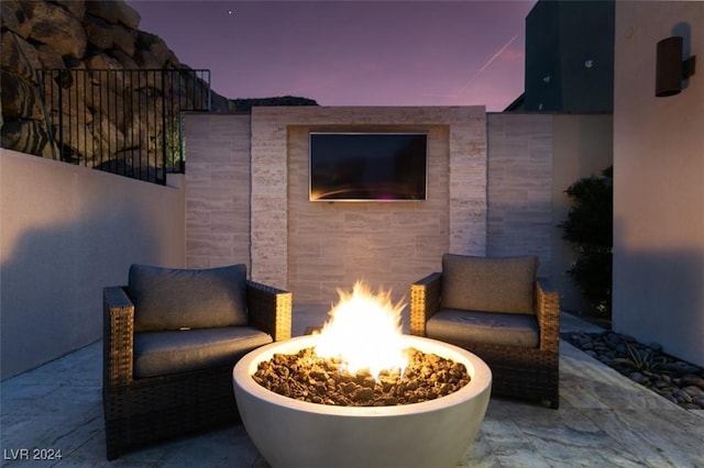 view of patio / terrace with a fire pit