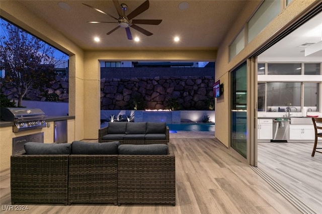 exterior space with outdoor lounge area, ceiling fan, area for grilling, and grilling area