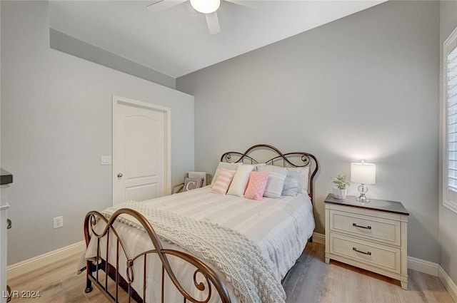 bedroom with ceiling fan and light hardwood / wood-style flooring