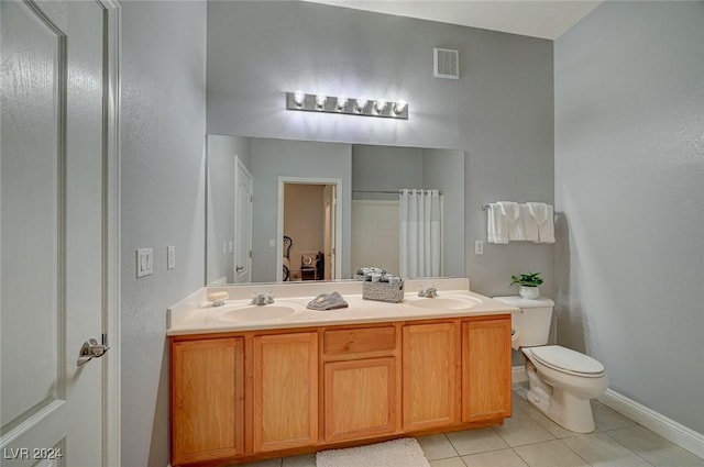 bathroom with tile patterned floors, vanity, a shower with shower curtain, and toilet