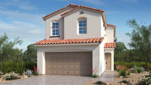 mediterranean / spanish-style home featuring a garage