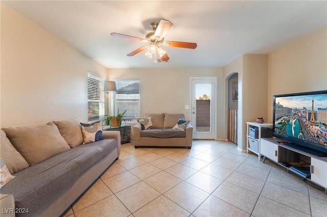 tiled living room with ceiling fan