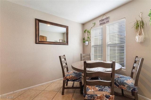 dining space with light tile patterned flooring