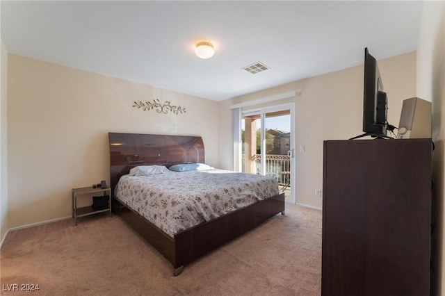 bedroom featuring carpet flooring and access to exterior