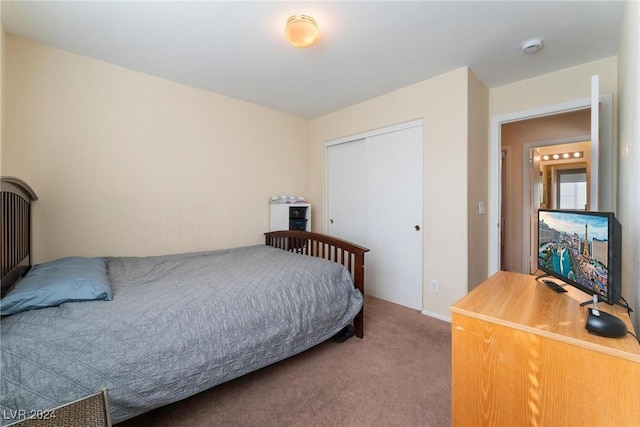 carpeted bedroom featuring a closet