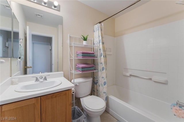 full bathroom featuring shower / tub combo with curtain, vanity, and toilet