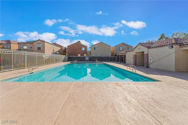 view of swimming pool with a patio