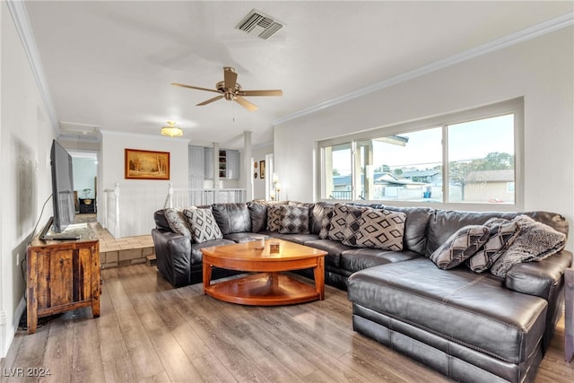 living room with crown molding, ceiling fan, and hardwood / wood-style floors