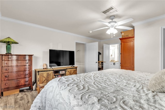 bedroom with ornamental molding, ceiling fan, and light wood-type flooring