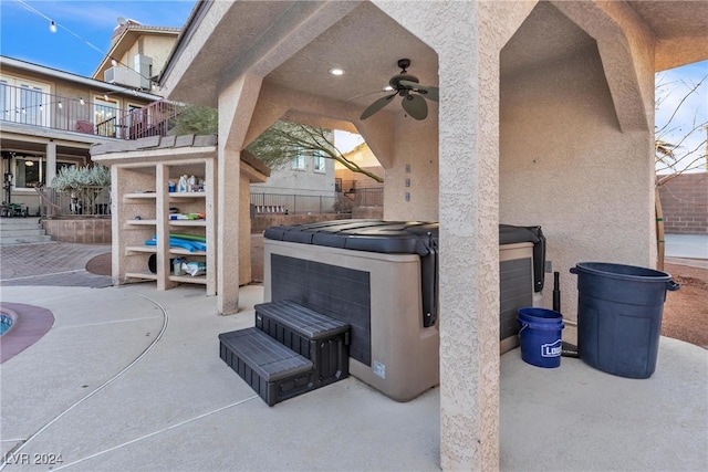 view of patio / terrace featuring a hot tub and ceiling fan