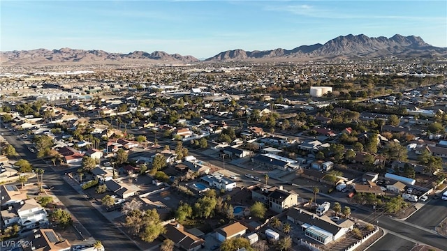 birds eye view of property featuring a mountain view