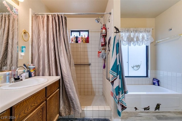 bathroom with vanity, separate shower and tub, and wood-type flooring