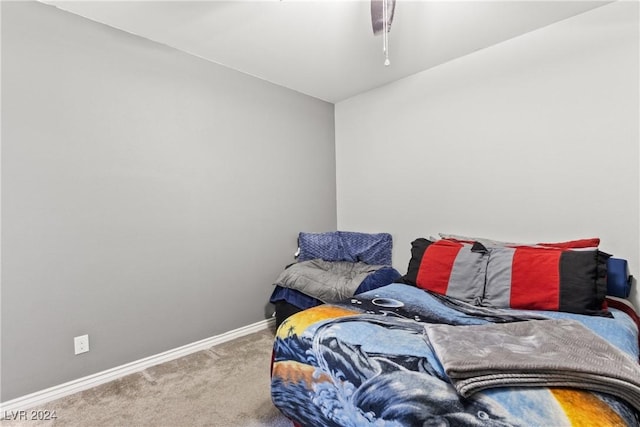 bedroom featuring carpet floors, baseboards, and a ceiling fan