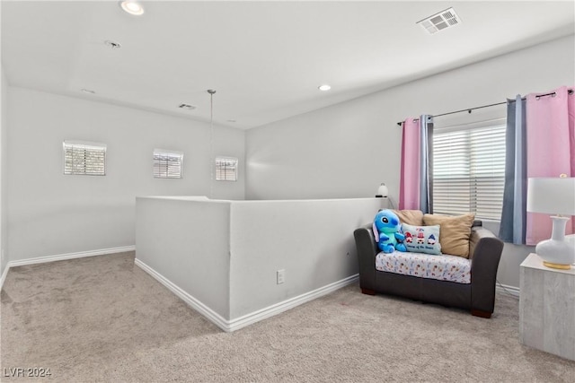 living area featuring baseboards, visible vents, carpet flooring, an upstairs landing, and recessed lighting