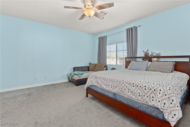 bedroom featuring a ceiling fan, carpet flooring, visible vents, and baseboards