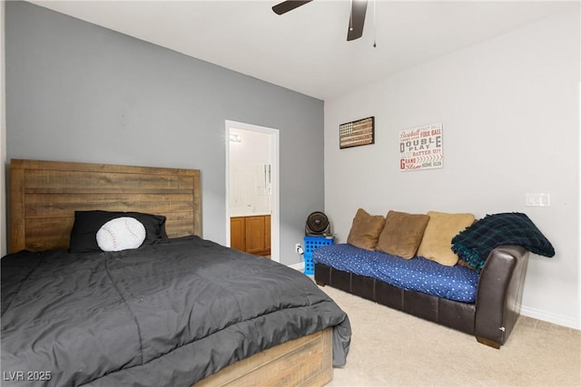 bedroom with carpet floors, a ceiling fan, baseboards, and ensuite bathroom