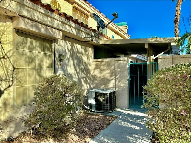 view of side of property with cooling unit