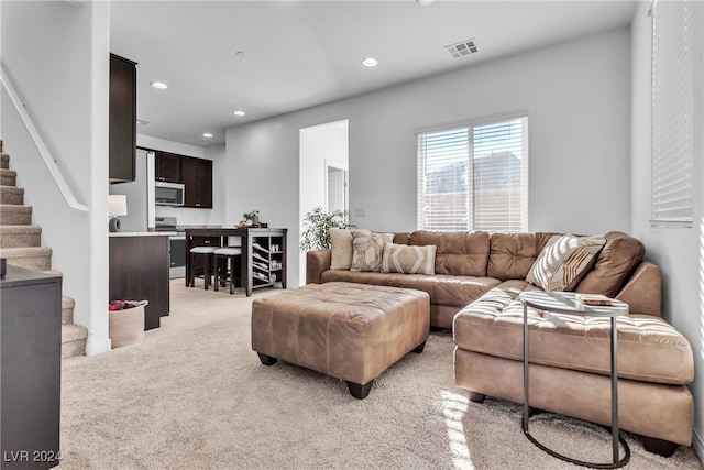 living room featuring light colored carpet