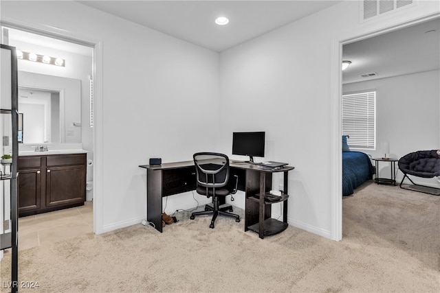 carpeted office with sink