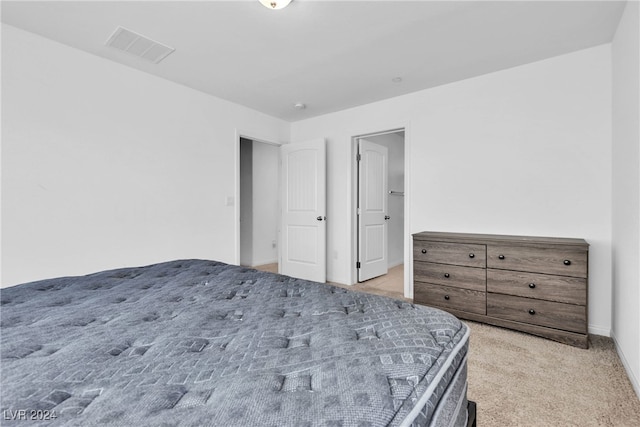 bedroom featuring light colored carpet