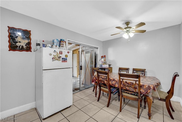 dining area featuring ceiling fan and light tile patterned flooring