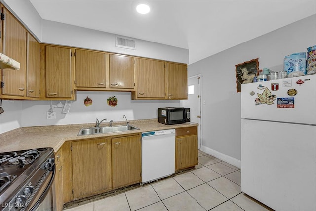 kitchen with sink, light tile patterned floors, and black appliances