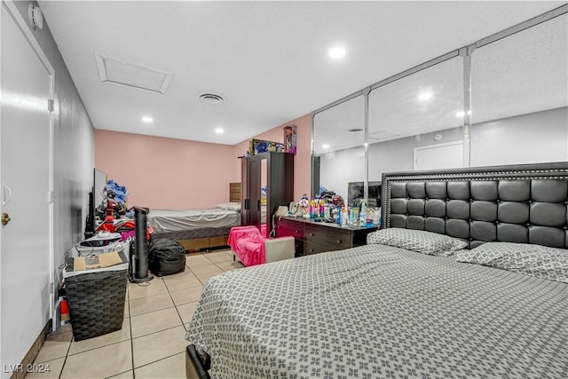 bedroom with light tile patterned flooring