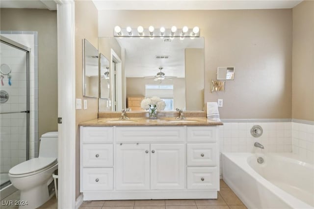 full bathroom featuring independent shower and bath, tile patterned flooring, vanity, ceiling fan, and toilet