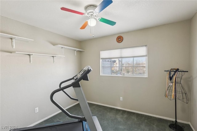 workout area featuring ceiling fan and dark carpet