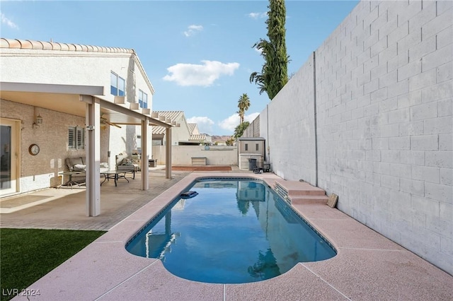 view of swimming pool with a patio