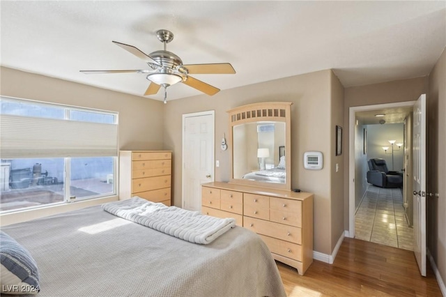 bedroom featuring wood-type flooring and ceiling fan