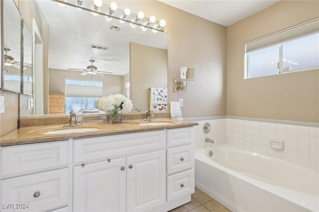 bathroom with vanity, a bathtub, tile patterned floors, and ceiling fan