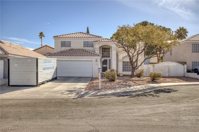 mediterranean / spanish house featuring a garage